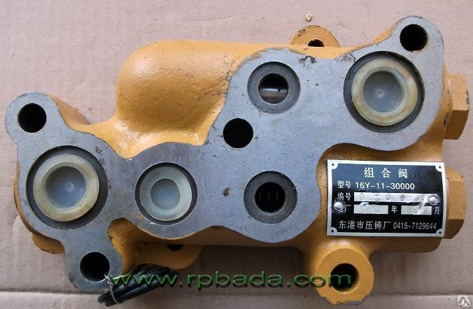 Где находится переливной клапан бульдозера шантуй sd16